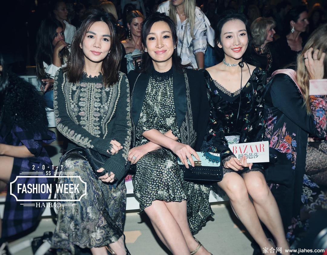 王鸥回眸瞬间，发丝轻扬，身着黑色套装于都市背景中定格