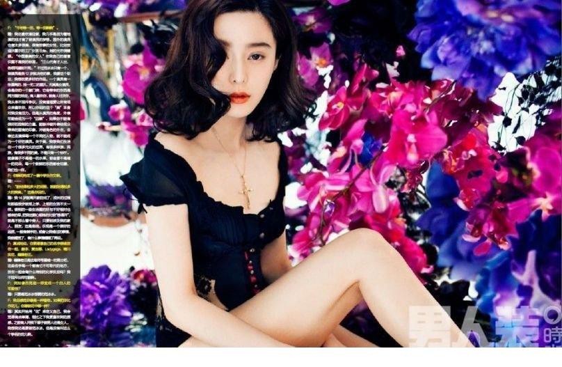 范冰冰侧卧于纯白背景中，一袭黑衣勾勒曲线静谧中暗藏诱惑